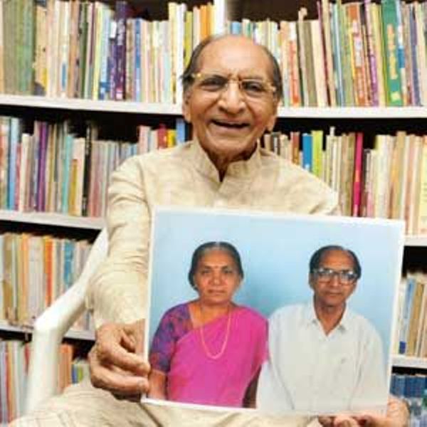 Anandiben Patel's husband holding a picture of them