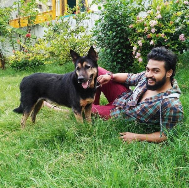 Bala Hasan posing with his pet dog