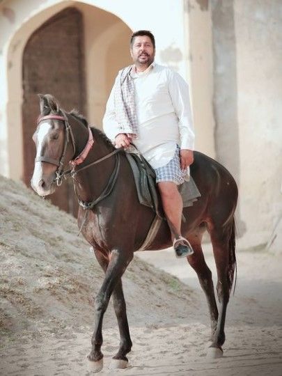 Kaka sitting on a horse