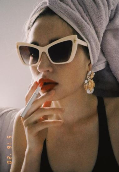 Maria Ryaboshapka smoking a cigarette