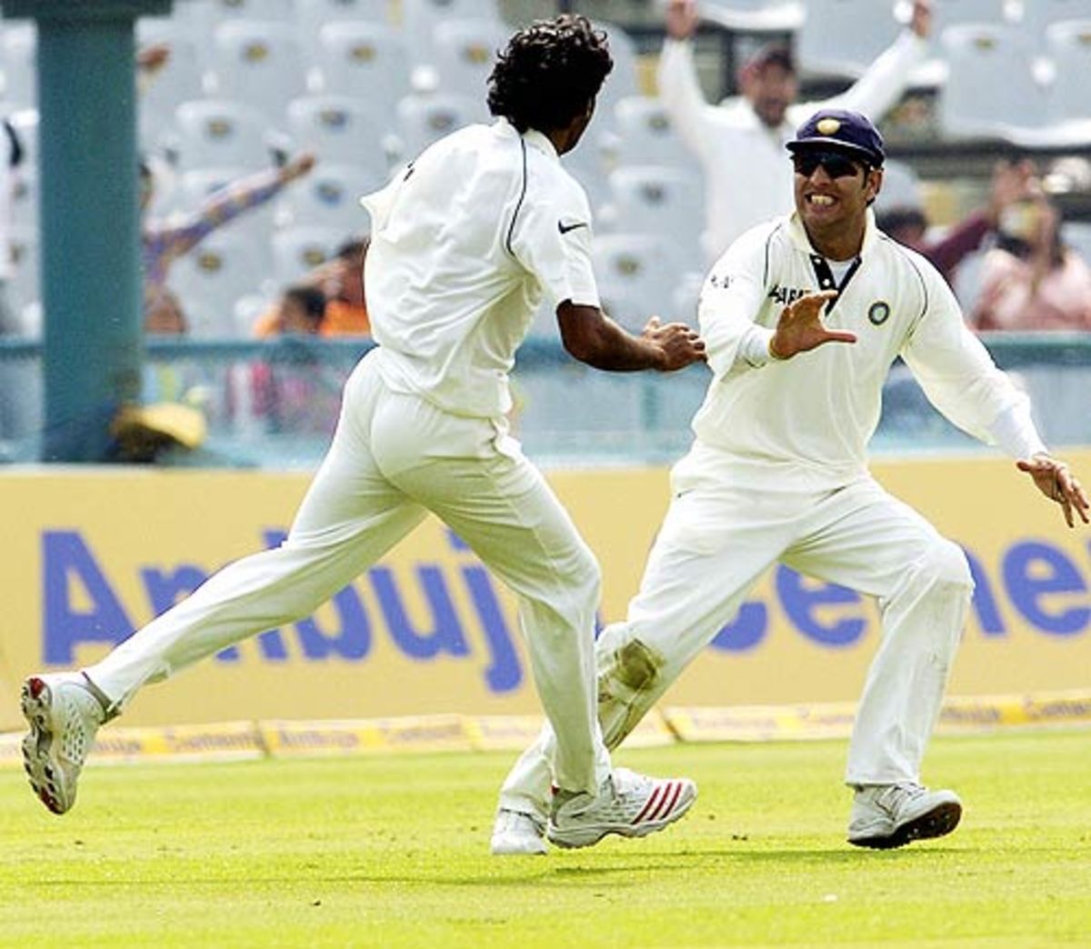 Munaf and Yuvraj celebrates a wicket during a match against England at Mohali in 2006