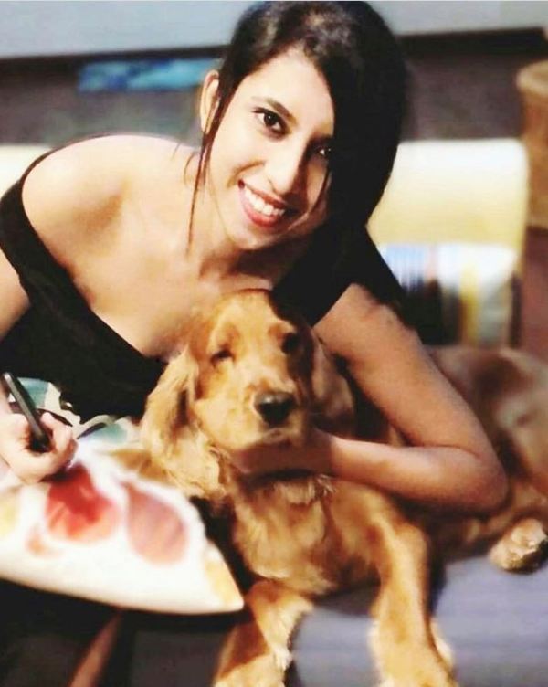Nikitha Shiv posing with her pet dog