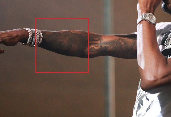 Young Dolph's tattoo on right forearm