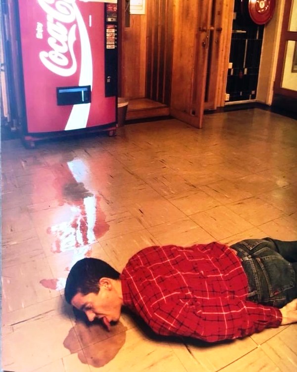 A picture of Tor Eckhoff licking coke off the floor, shot in 1990
