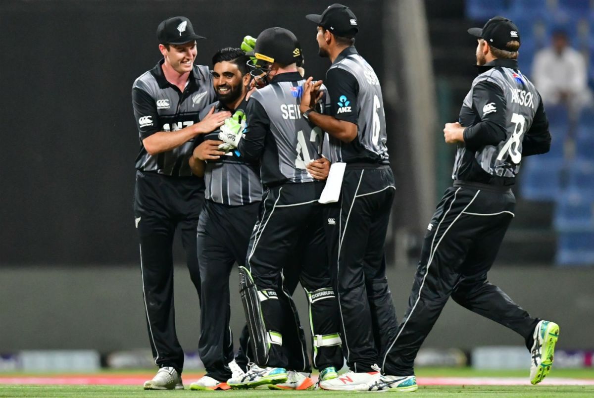 Ajaz Patel being congratulated by teammates after taking his maiden international wicket against Pakistan on 31 October 2018