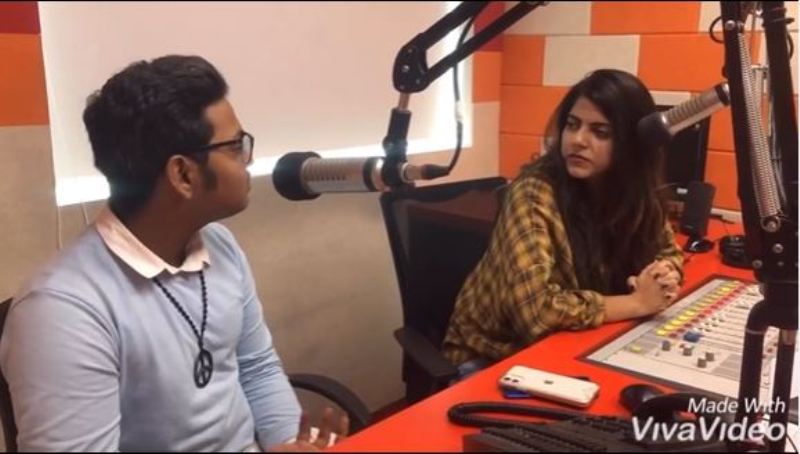 Ayush Gupta while conversing with a radio jockey on a radio interview