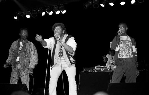 Kangol Kid performing on stage with other members of UTFO