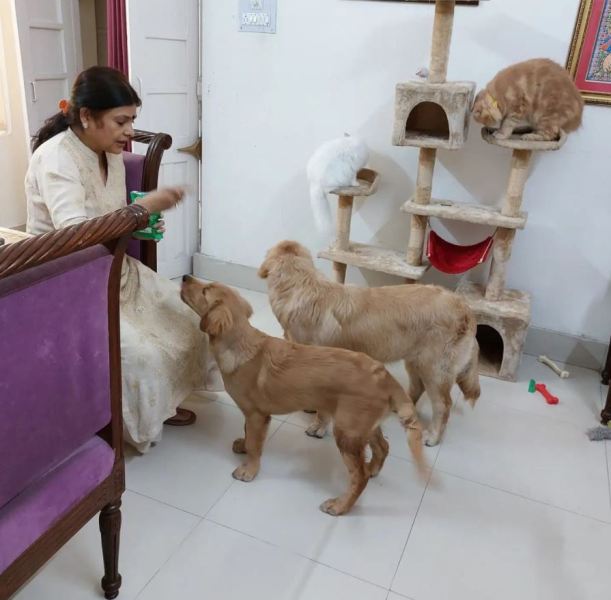 Malini Awasthi with her pets at home