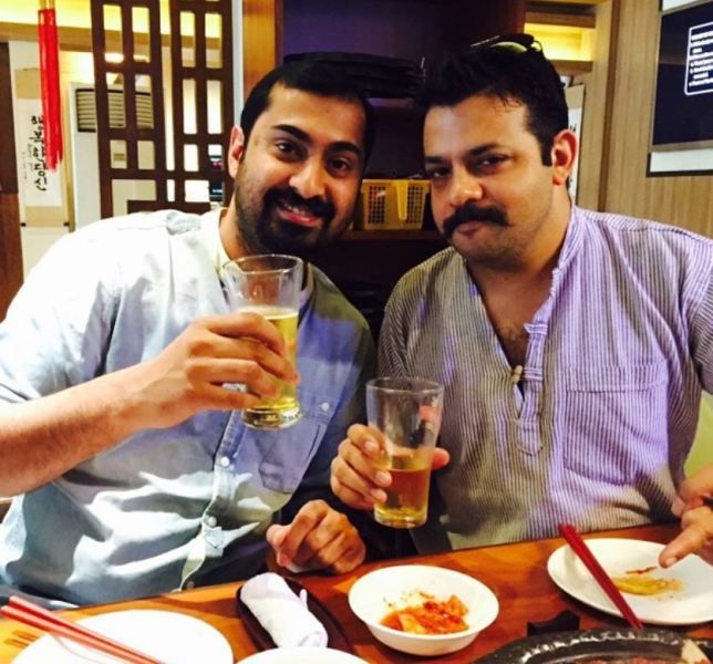 Nakul Vengsarkar enjoying a glass of beer with his friend