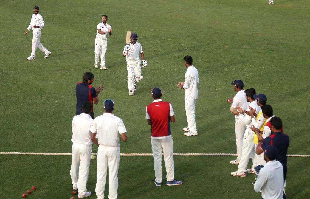 Priyank Panchal recieving a warm welcome from his teammates after scoring 314 runs against Punjab