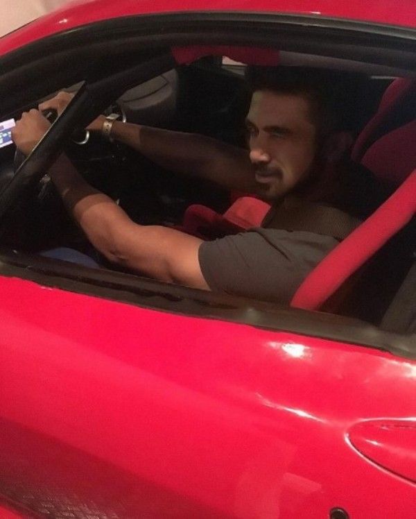 Saqib posing with his car