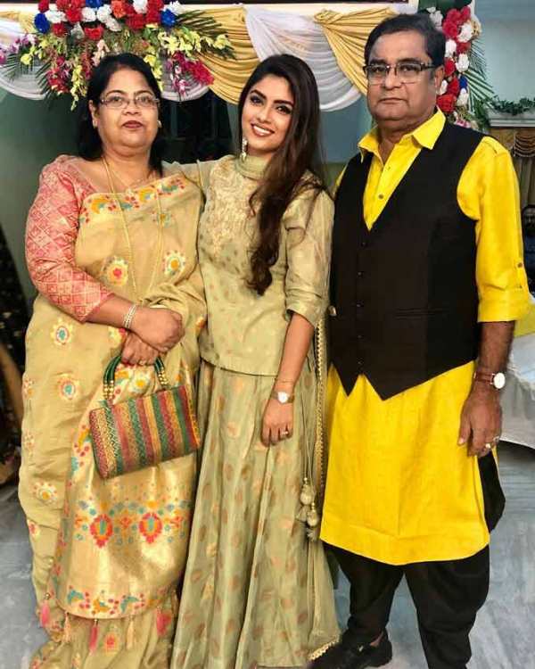 Sayantani Ghosh with her parents