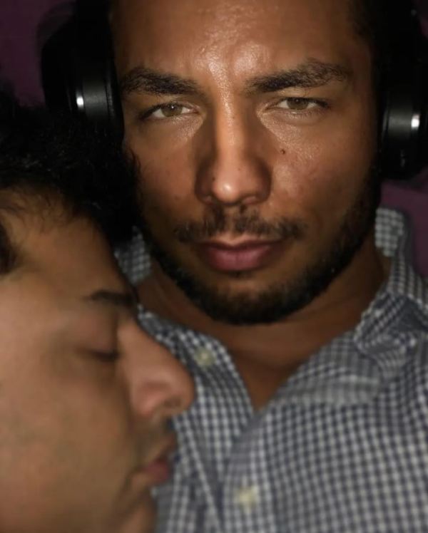 Shrien Dewani (eyes closed) cuddling with his boyfriend in 2018