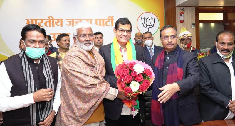A picture of Arvind Kumar Sharma joining BJP in the presence Swatantra Dev Singh and Dinesh Sharma at BJP's office, in Lucknow, on 14 January 2021