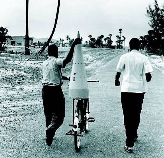 A rocket part being brought on bicycle to Thumba