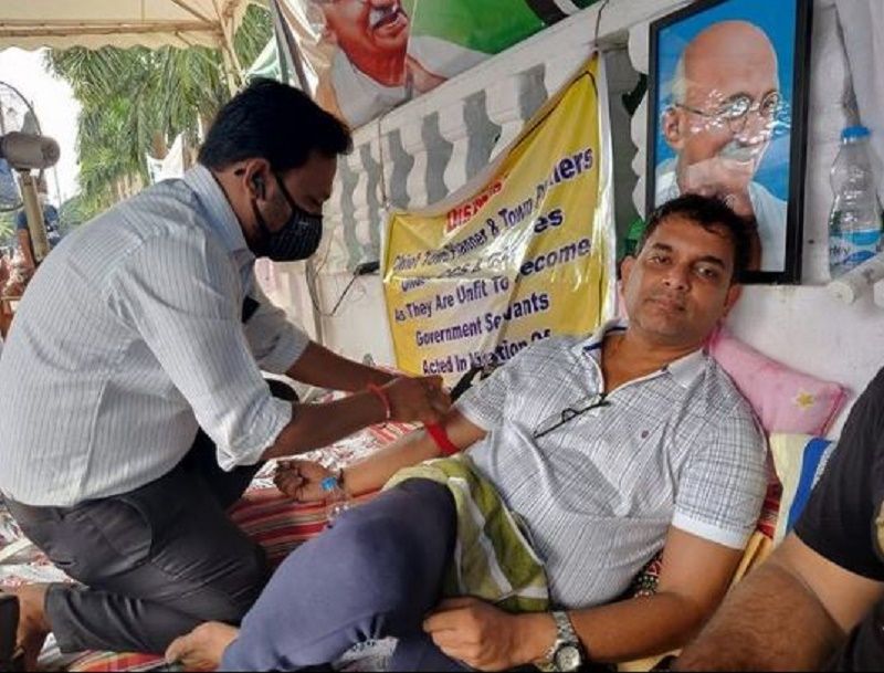 Amit sitting on a hunger strike