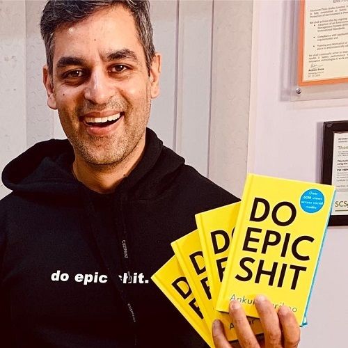 Ankur Warikoo holding copies of his books Do Epic Shit