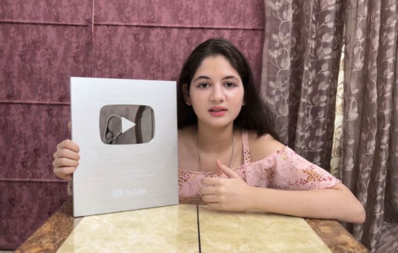 Harshaali Malhotra with the Silver Play Button