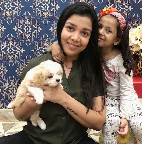 Priyanka Maurya and her daughter with their pet dog