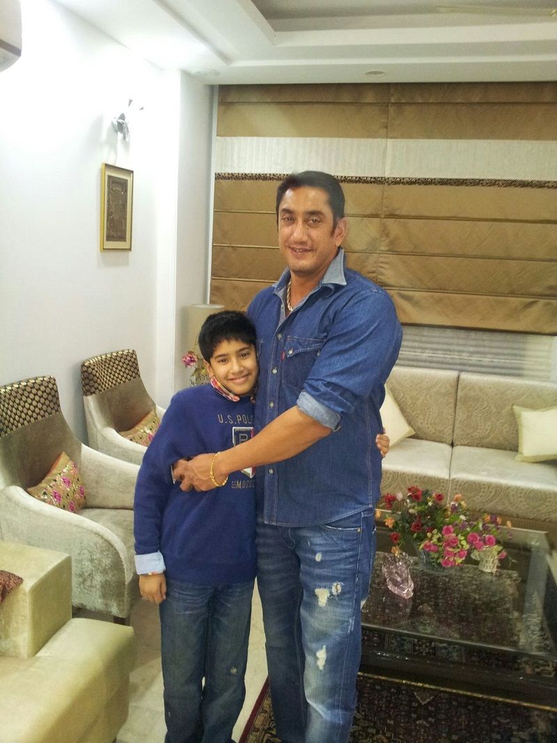 Raj as a kid with his father