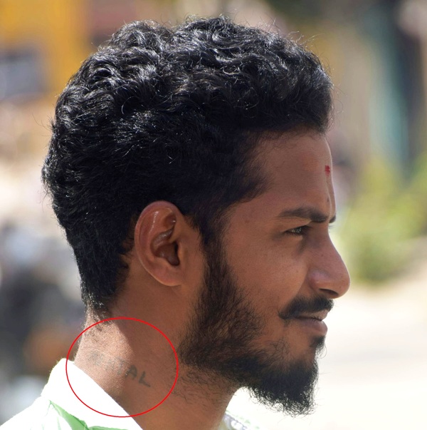 An image of Bajrang Dal activist Harsha showcasing his 'Mental' tattoo