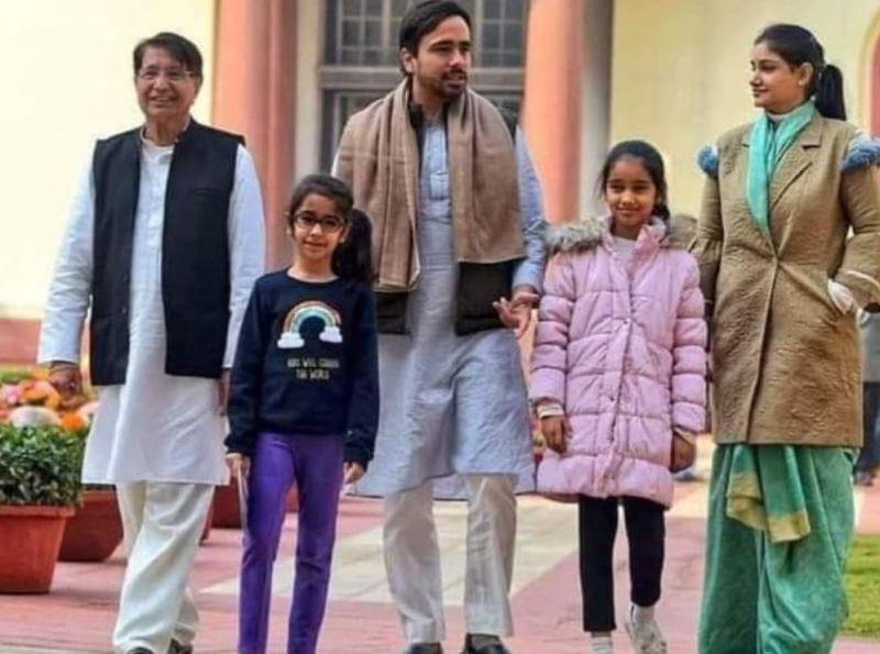 Charu Singh with her husband, daughters, and father-in-law