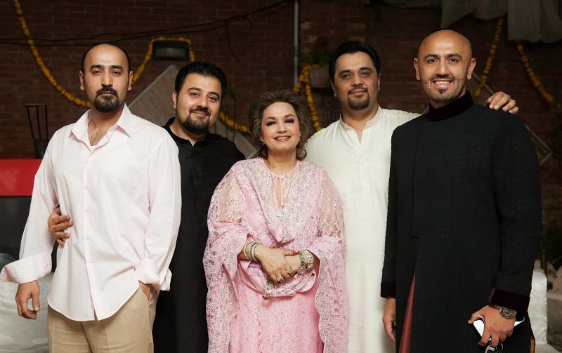 Hamza Ali Butt with his mother and brothers