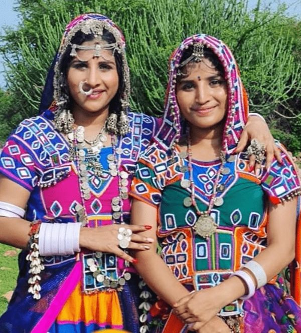 Indravathi with her sister in their traditional Banjara outfits