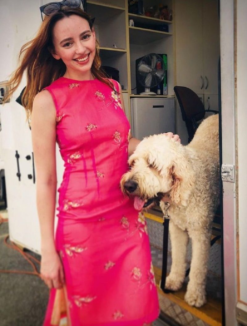 Natasha Bassett posing with her dog