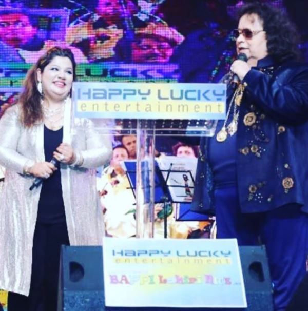 Rema Lahiri performing during a stage show with her father