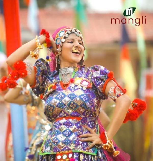 Satyavathi Rathod dancing in her traditional Banjara clothes