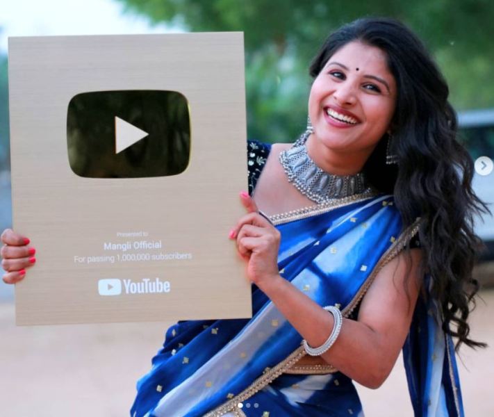 Satyavathi Rothod holding her Gold Play Button from Youtube