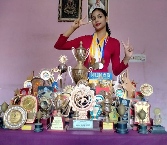 Shreya Lenka with the awards she won in dance competitions