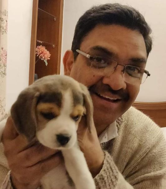 Asim Arun with his pet dog