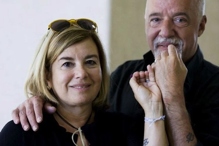 Christina Oticcia and Paulo Coelho in matching tattoos designed by her