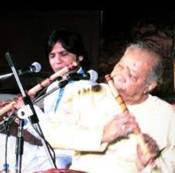 Manuraj Singh Rajput performing a stage show with his music master