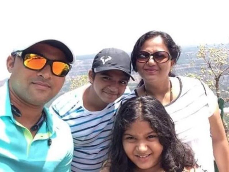 Pravin Tambe with his wife and children