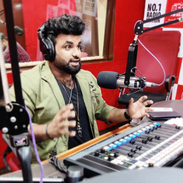 RJ Chaitu working in Red FM Hyderabad's office