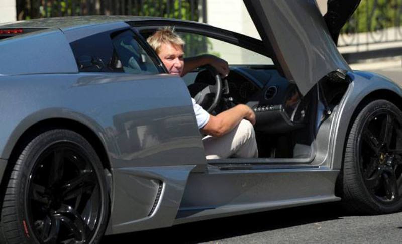 Shane Warne in one of his cars