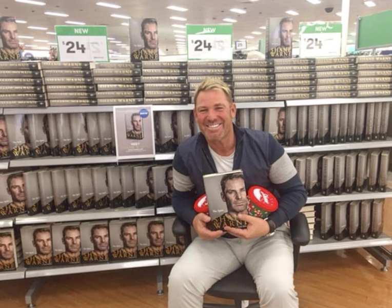 Shane Warne with his book No Spin