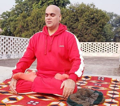 Swami Chakrapani doing Yoga