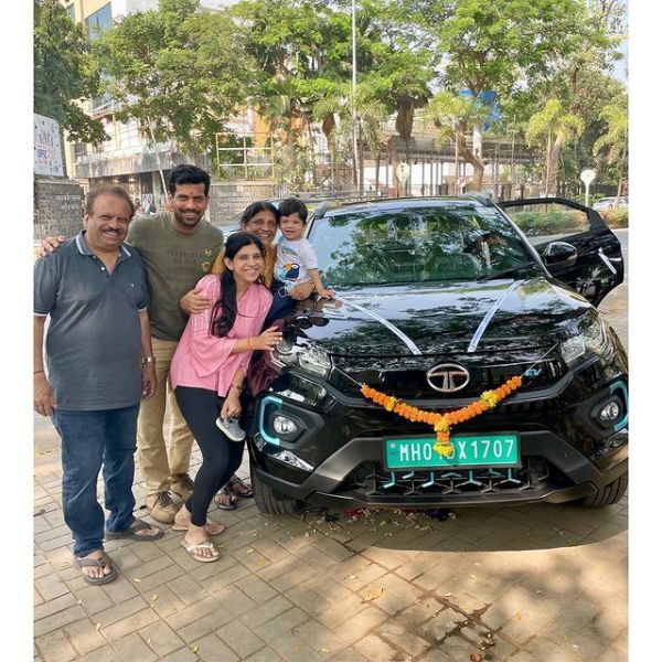 Aashutosh and his family with his electric Tata Nexon car