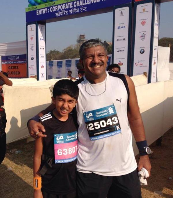 Aditya and his father at the standard chartered marathon in 2014