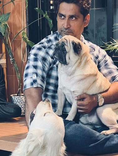 Chinmay Mandlekar with his pet dogs