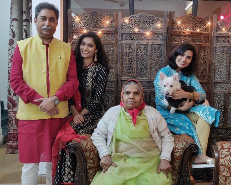 Rakesh Pathak with his mother and daughters