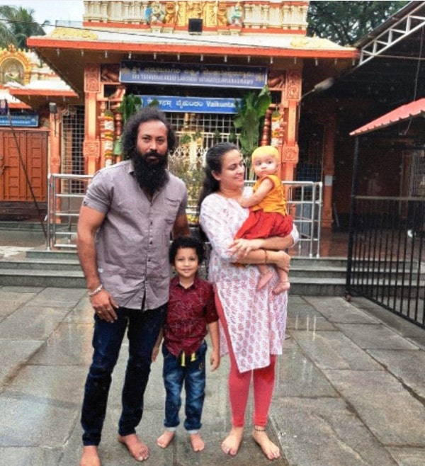 Ramachandran Raju with his family in a temple