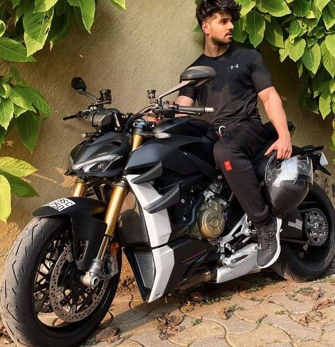 Sooraj Pancholi sitting on his motorcycle