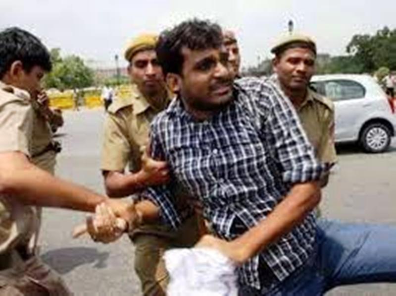 Nilotpal Mrinal being manhandled by the police during the CSAT Movement (2015)