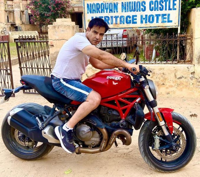 Akshay Anand poses with his bike