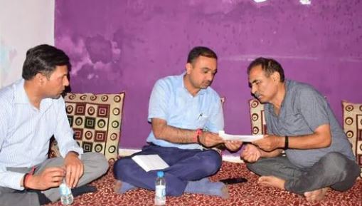 Jammu divisional commissioner Ramesh Kumar hands over the appointment letter and ex gratia amount to a family member of slain government employee Rahul Bhat in Jammu.